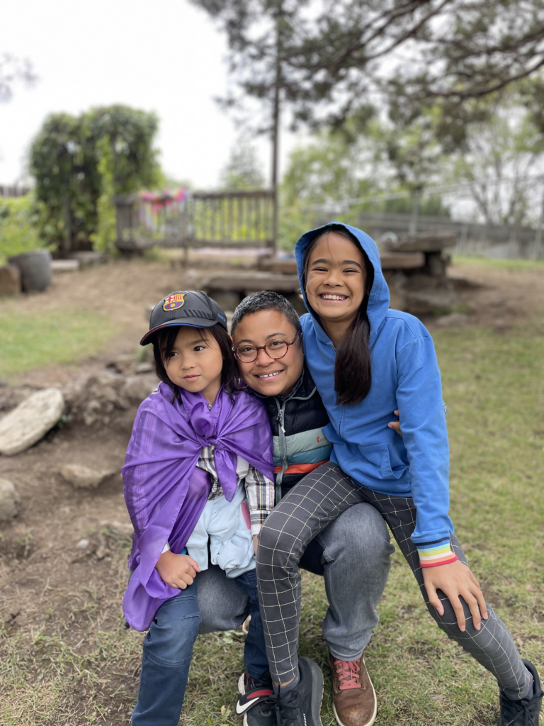 Kina and their two kids.